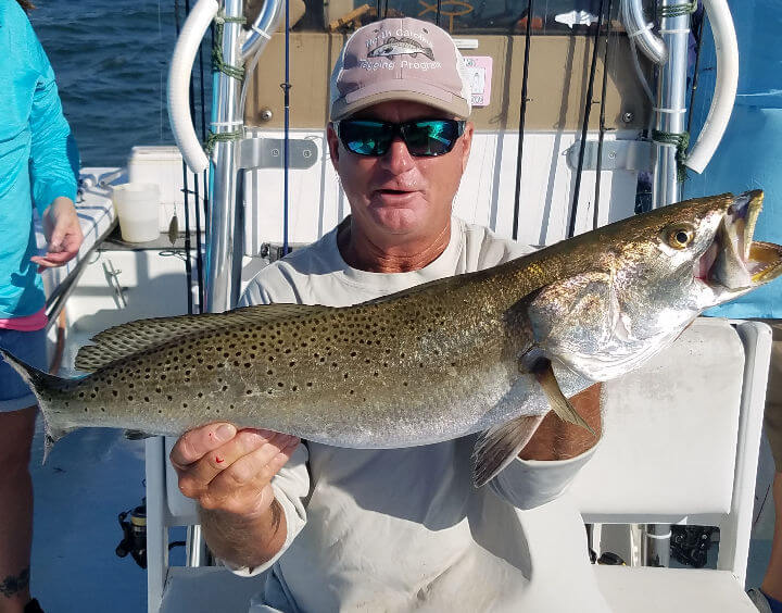 Capt. Rick Scarborough holding a speckled trout.
