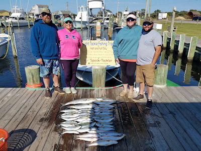 Group standing behind their catch at Teach's Lair dock.