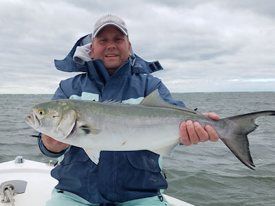 Tim Gunning holds up a large Pamlico Sound Bluefish.