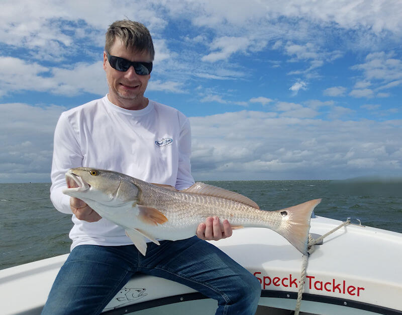 Andy holding out a really nice Red Drum caught on light tackle.