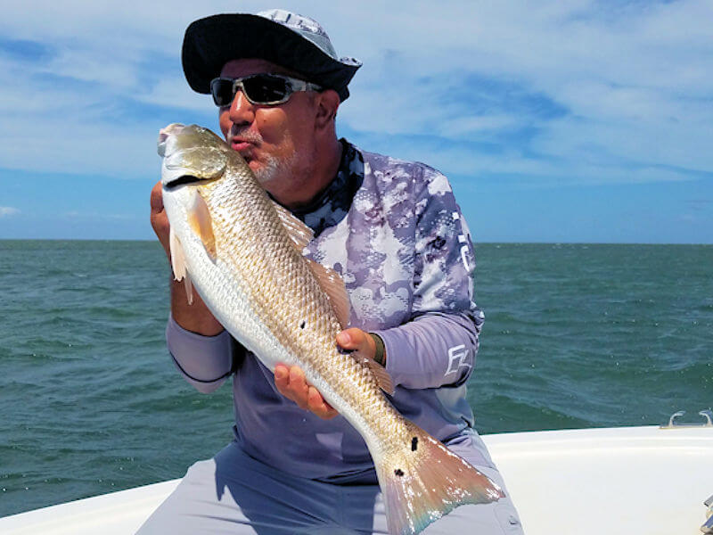 JT gives his Red Drum a bit of love.