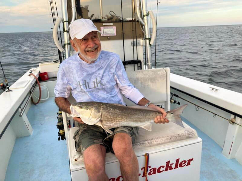 Angler holds his big Red Drum for a picture before it was released.